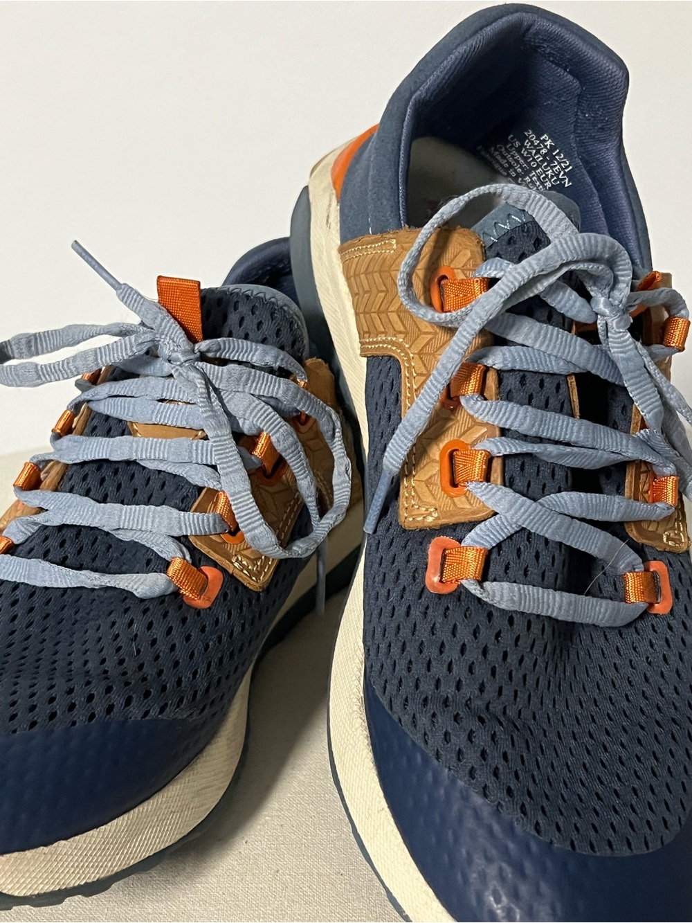 OluKai Navy Blue Athletic Shoes with Orange Accents and Light Gray Laces